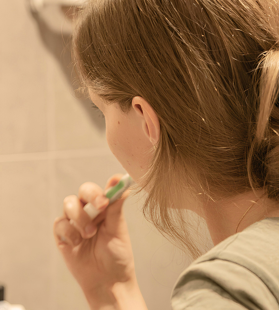 Woman brushing teeth