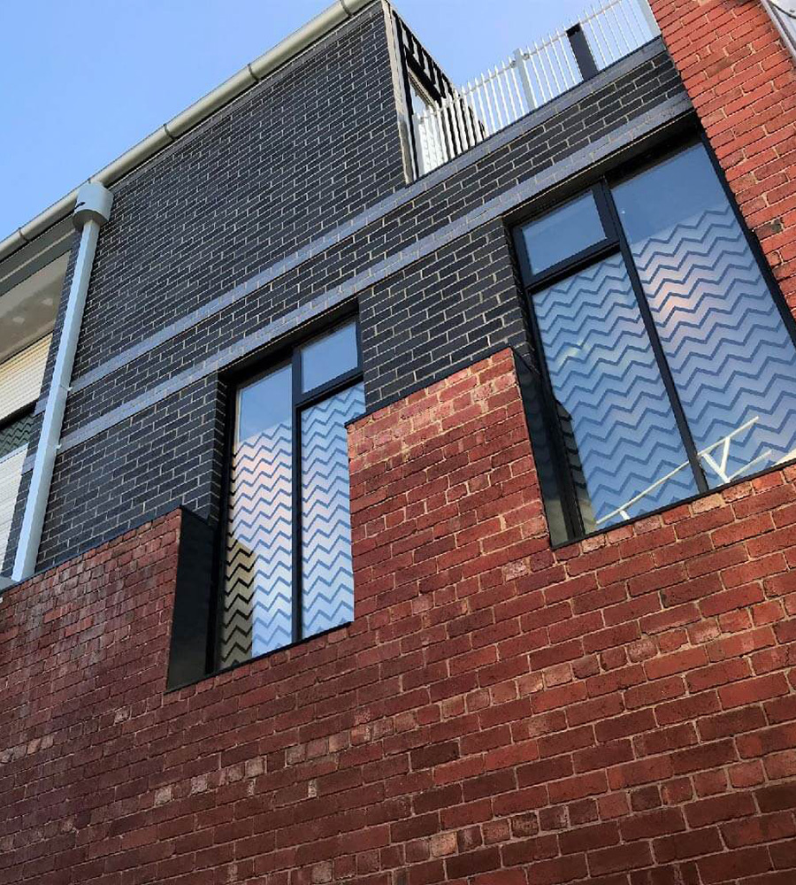 Urban building with custom window film