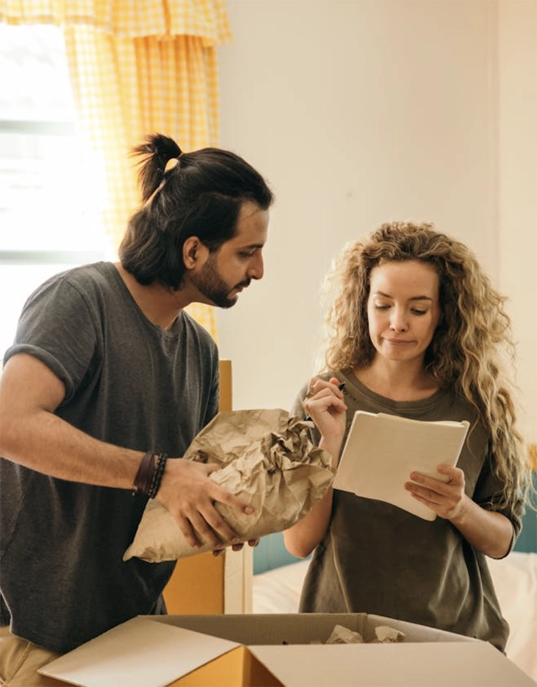 Couple packing their property after eviction