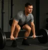 Athlete performing a classic lift (e.g., squat, deadlift, overhead press) with strong form and focus in a gym setting
