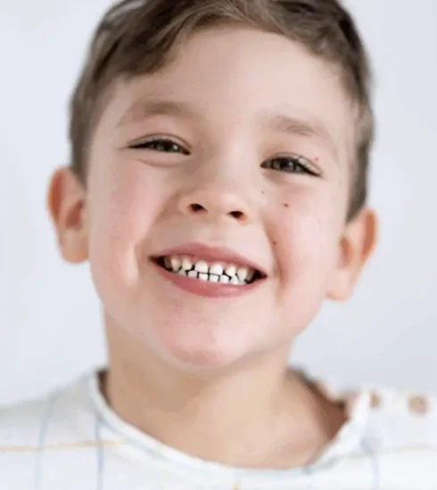 Smiling young boy showing clean teeth after checkup at a Sarasota family dental practice