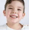 Smiling young boy showing clean teeth after checkup at a Sarasota family dental practice