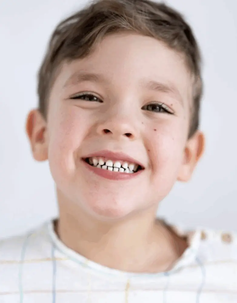 Smiling young boy showing clean teeth after checkup at a Sarasota family dental practice
