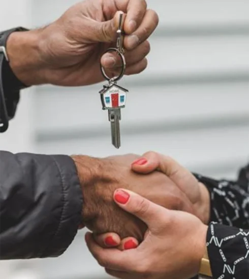 Person Holding Silver Key