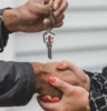Person Holding Silver Key