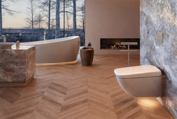Luxury bathroom with herringbone wood floors and freestanding bathtub