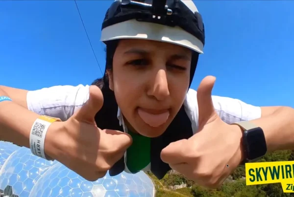headcam view of a person video on zip wire, thumbs up, tongue out