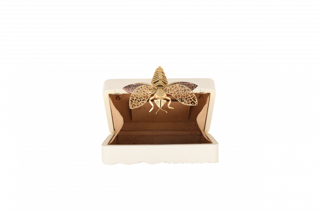 Triangle Cream Dragonfly Clutch by  on curated-crowd.com