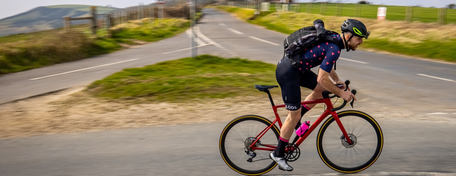 A man cycling on a country road