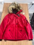 Red Quilted Jacket with Faux Fur Hood and Sleeve Zip Pocket