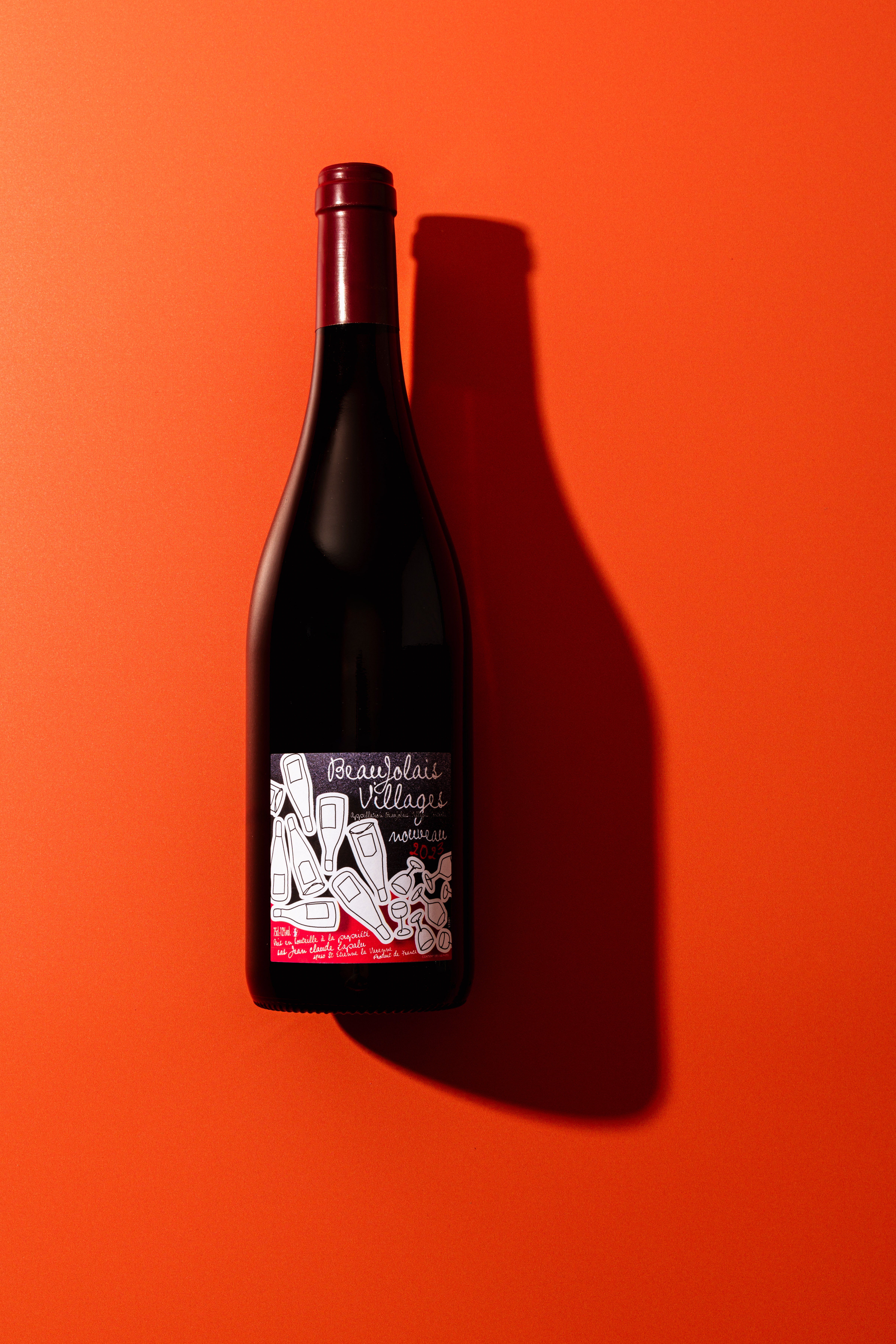 Beaujolais nouveau on orange backdrop