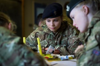 Three cadets wearing the ACF uniform at a table