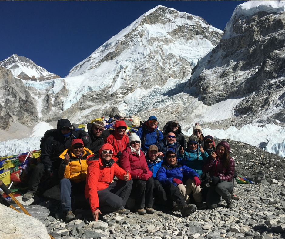 Group of hiking posing with a mountain backdrop