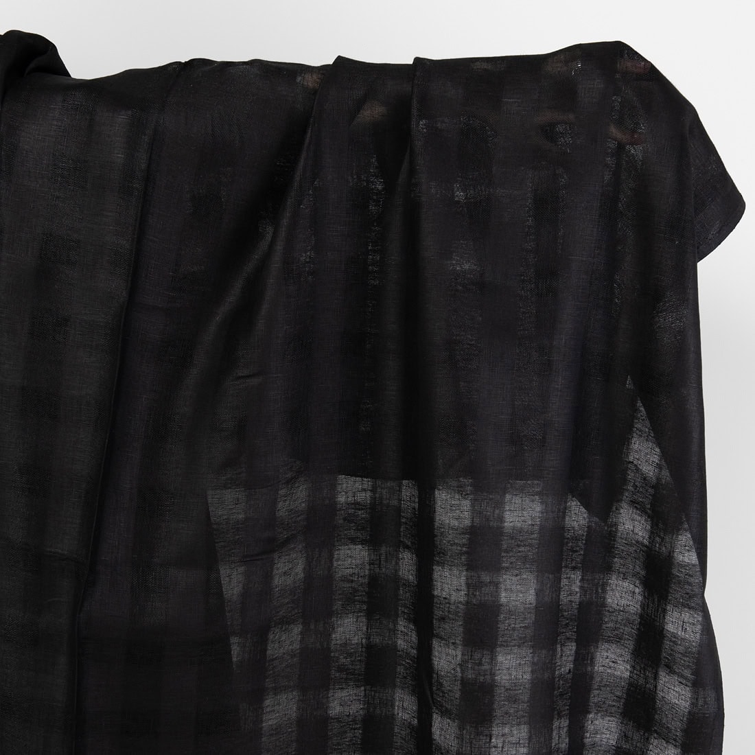 Black linen fabric with open weave checks.