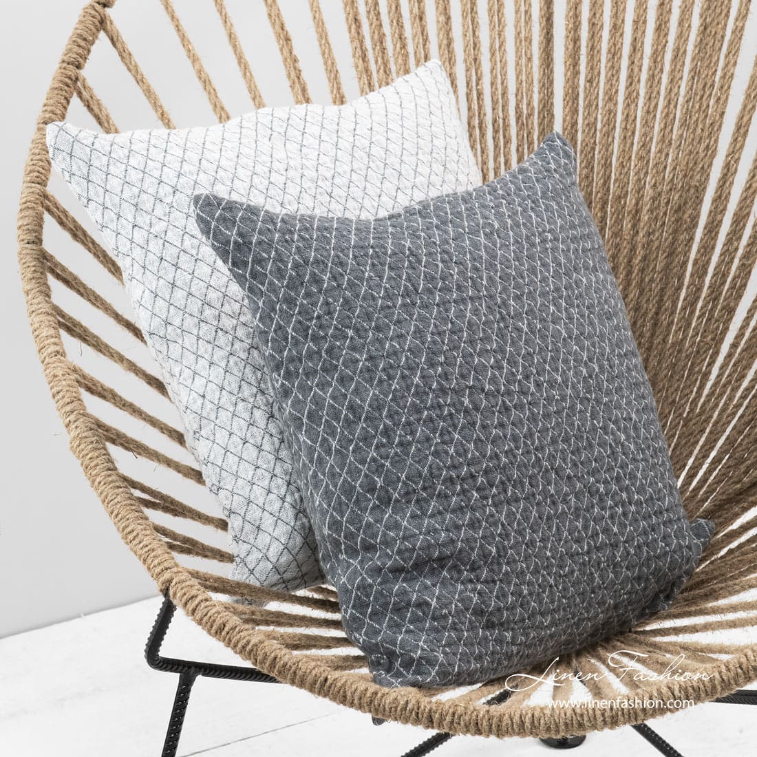 Grey linen cushion cover with white rhombuses