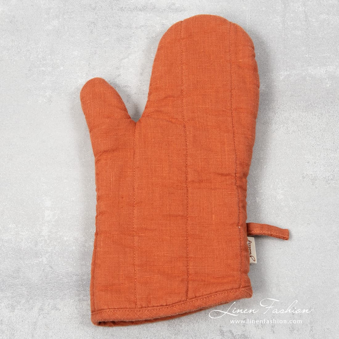Orange linen oven glove, gamma.