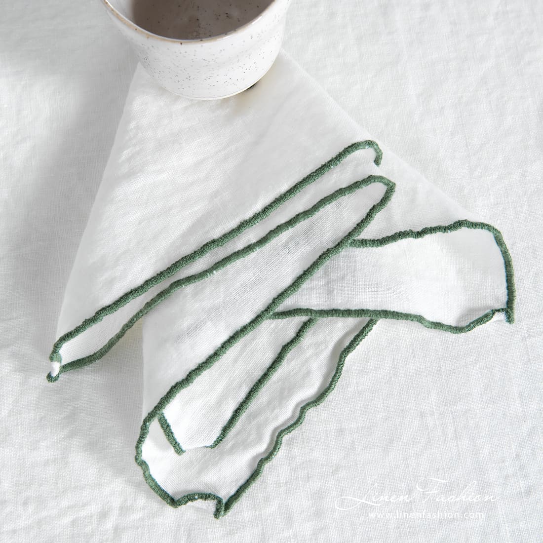 ARVO white napkin with green border