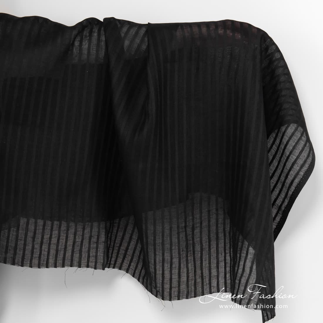 Black lightweight striped linen fabric.