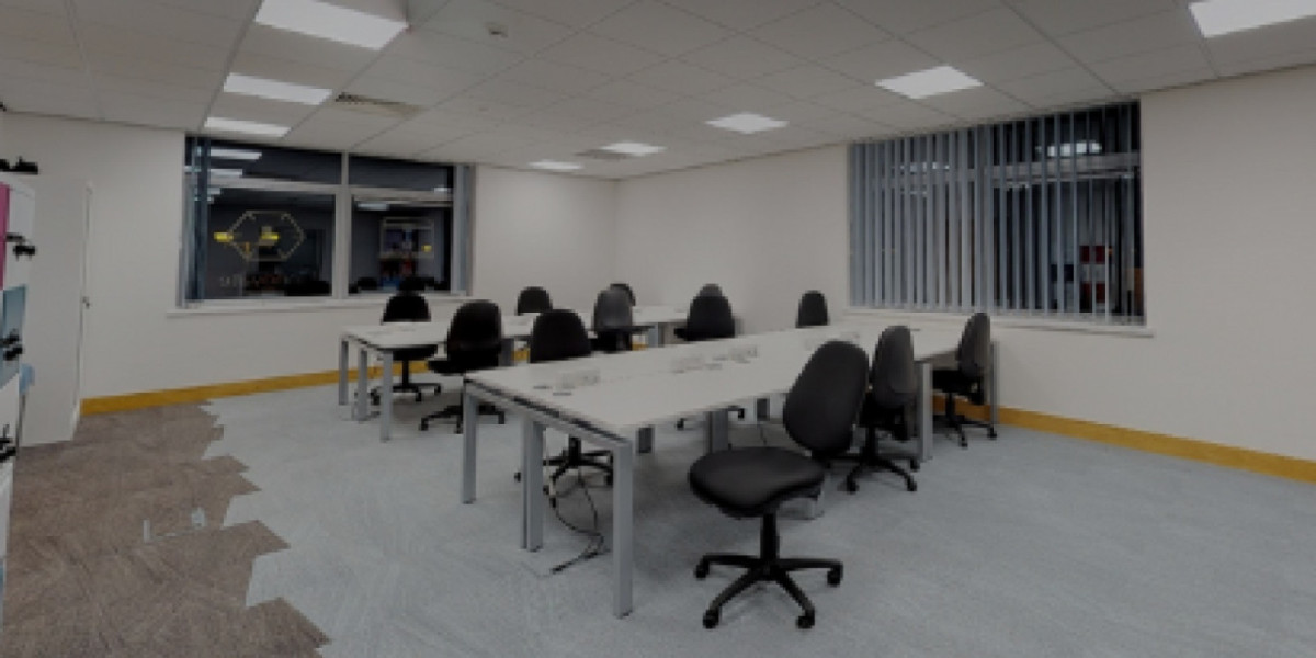 Open-plan coworking area with bench desks at Cranfield Eagle Lab
