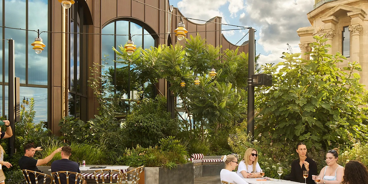 Members on the roof terrace at x+why Arding & Hobbs, Battersea
