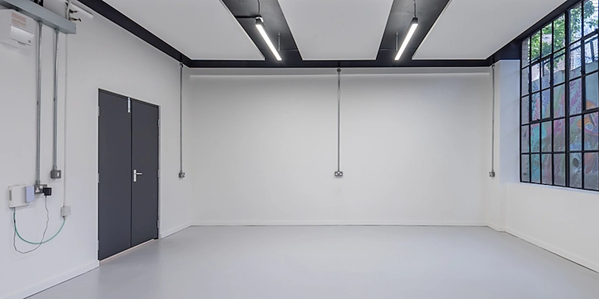 Empty studio unit with Crittall-style window at Battersea Business Centre