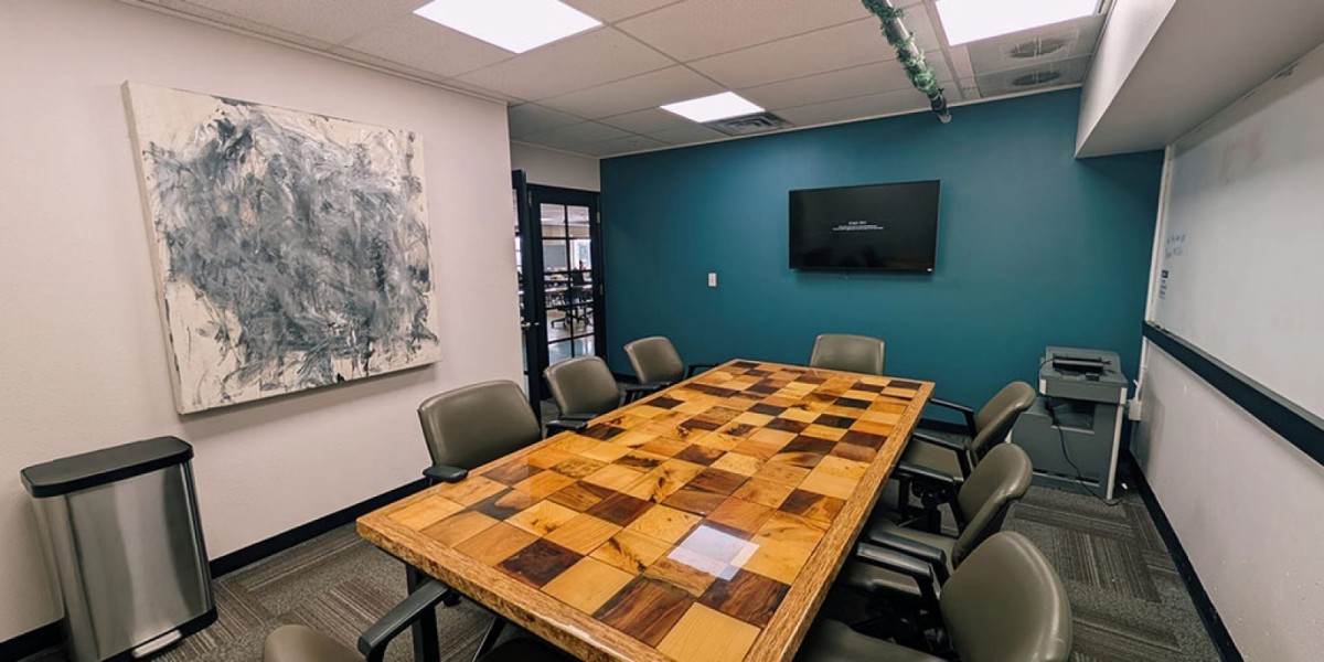 Meeting room at Mile High Coworking Space overlooking Empower Field Stadium