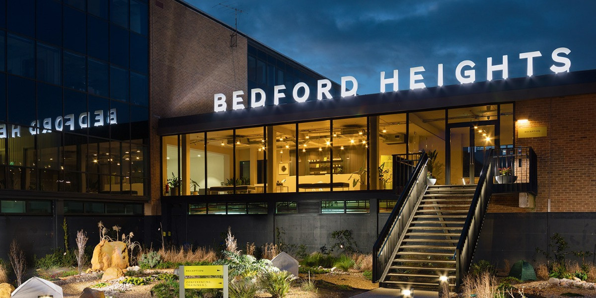Bedford Heights business centre on Brickhill Drive, Bedford, lit up at dusk