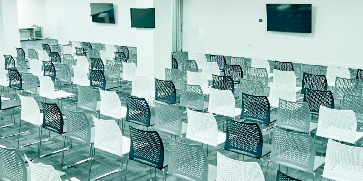 Meeting and event room set up with rows of chairs