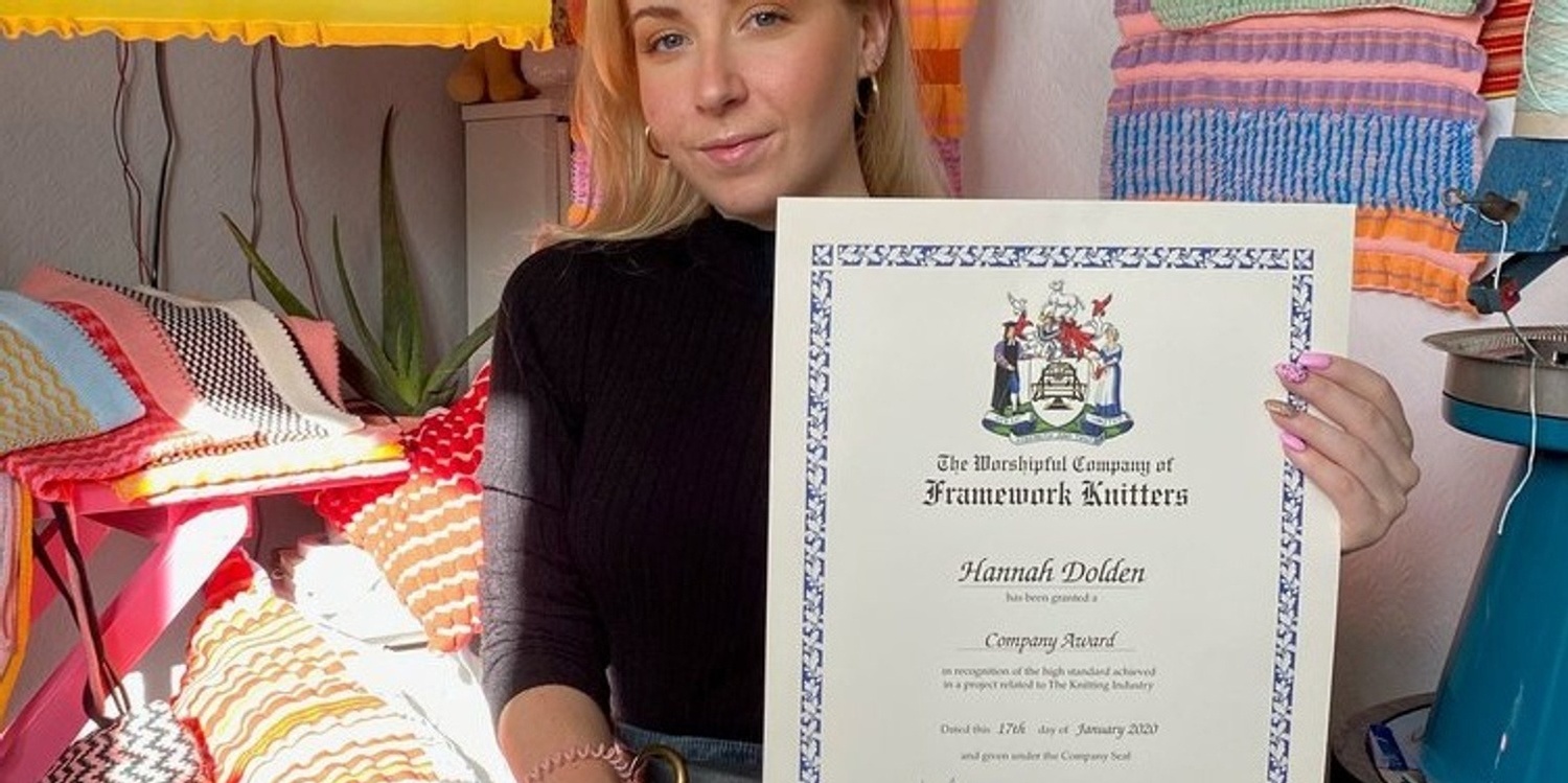 A student holding their award
