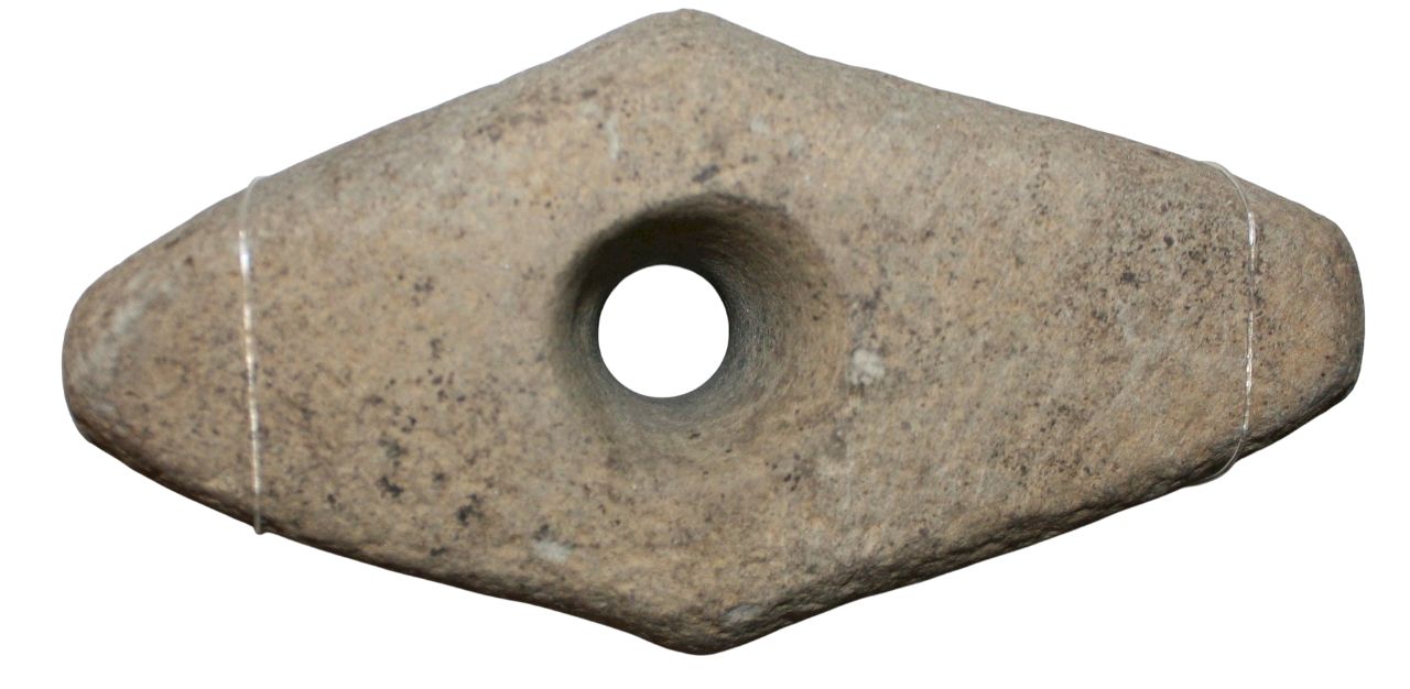 This is a prehistoric stone battleaxe with an elongated diamond shape. It has a smooth surface with natural speckles and a large central hole.