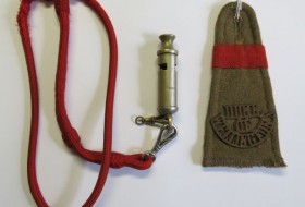 Metal service whistle and embroidered epaulette