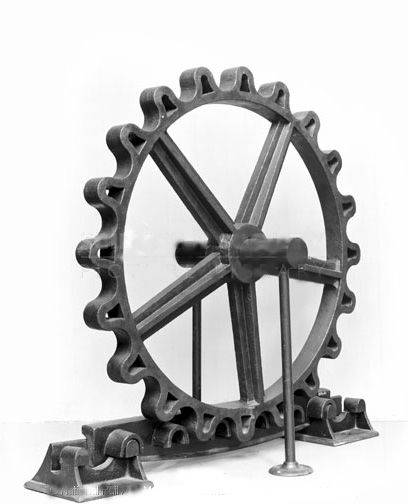 John Blenkinsop's rack and pinion, a large, cog shaped wheel, which fits neatly and securely into the piece below.