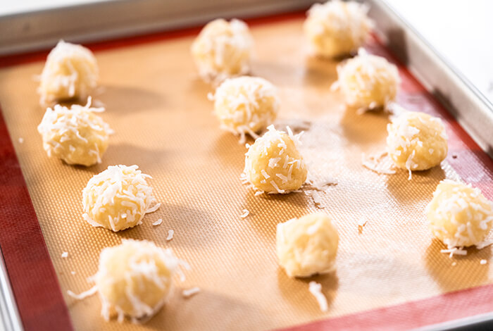 coconut crunch baked dog treats in a lined baking pan