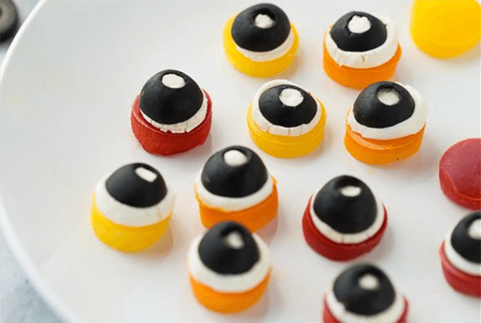 monster eye-shaped Halloween dog treats served on a white plate