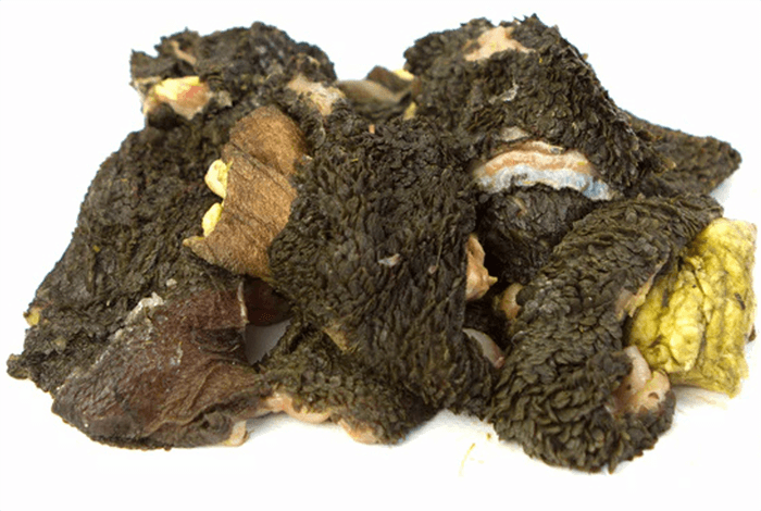 green tripe on a white background, ready for dog treats