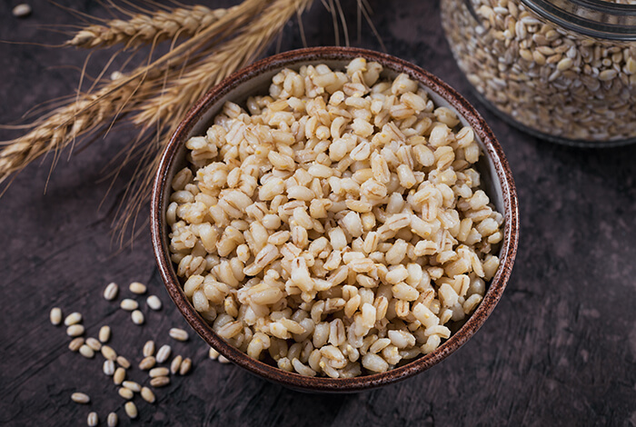 a bowl of cooked and peeled barley grains