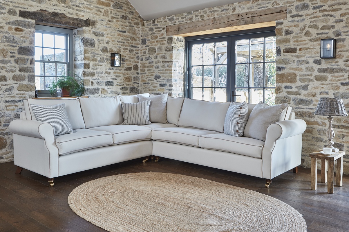 THE KENDAL 3 SEATER CORNER SOFA IN STAIN RESISTANT RECYCLED COTTON NOUGAT WITH DARK OAK FEET
