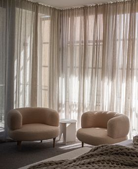Arc Lounge Chair in Faux Sheep