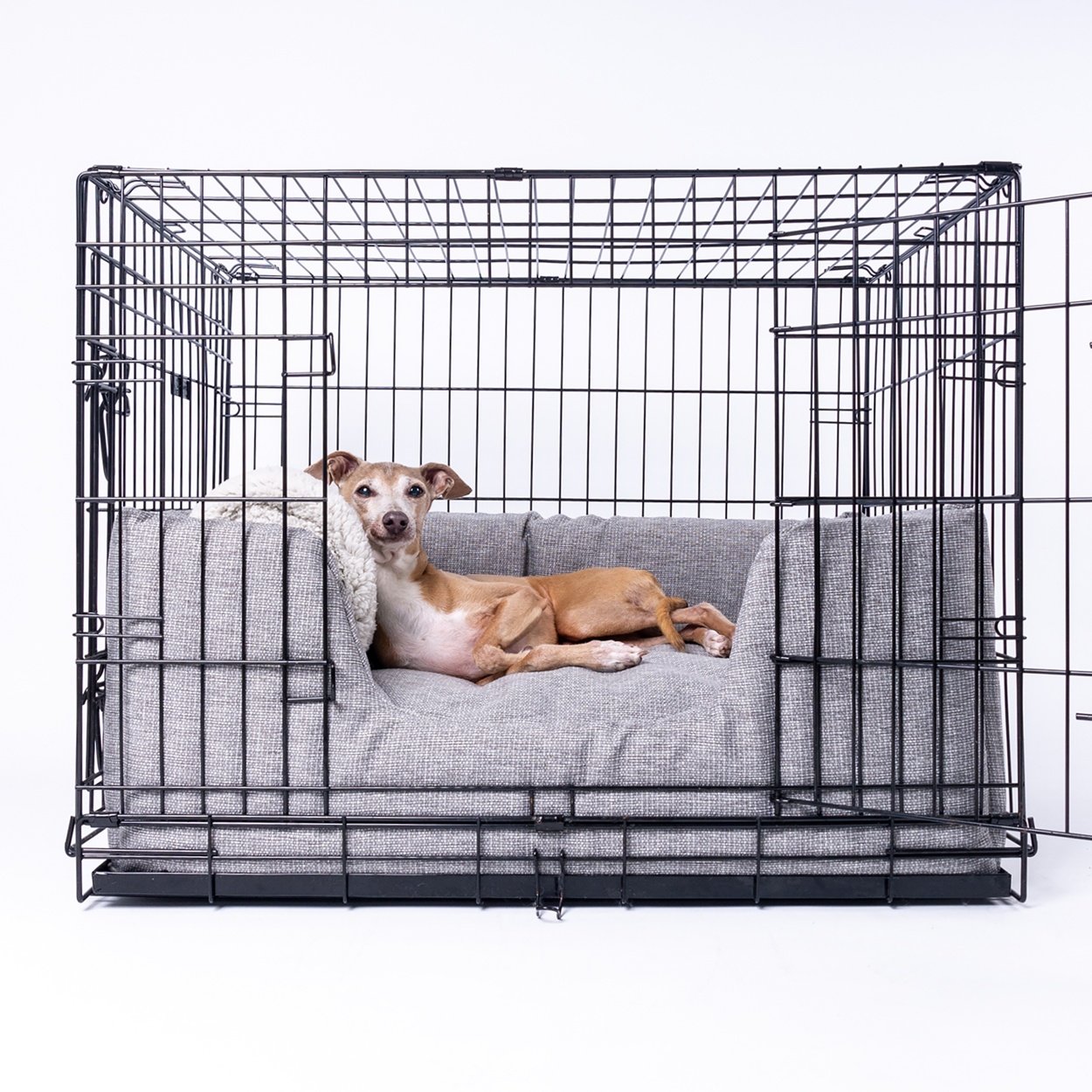 Charley Chau Deeply Dishy Luxury Dog Bed in Weave II in Heron Grey (shown in a dog crate)
