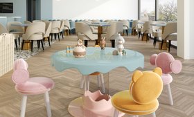 The Family Fun Club | let your kids have fun in this colorful playroom with Marshmallow sky blue activity table, Bonbon blush pink chair, Baloo orange chair, and wood flooring