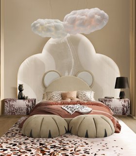 Kids Bedroom | beige paint bedding area with Baloo cosy bed, bedside table in portuguese tile for storage, Terrazzo rug, Cloud lamp, dark table lamp, and wallpaper