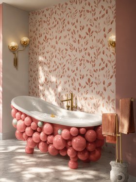 Kids Bathroom | pink paint bath in nature-inspired style for spring/summer season with Newton bathtub, gold wall lamp, towel rack, floral wallpaper, and marble flooring