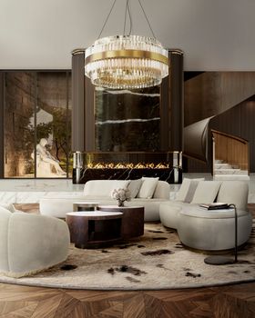 Living Room | autumn/winter decor with Antigua walnut wood center table, terrazzo rug, curvy sofa, gold chandelier, and fireplace