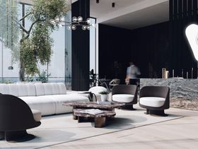 Summer Rooftop Bar by Sarah Done | cosy neutral living room with the brown marble Robusta center table and the curvy Demitasse armchair