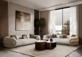 Living Room | autumn/winter decor in cosy neutral style with Gommosa curvy white sofa, Antigua brown marble center table, neutral rug, vase, and curtain