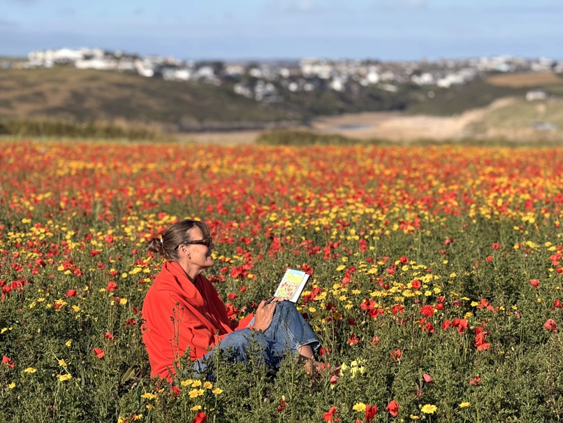 Cornish artist Joanne Short seen at work in a Cornish Poppy Field