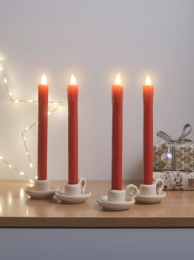 Four red TruGlow taper candles and Osby star light