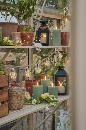 Spring Greenhouse Shelf Styling with TruGlow® Candles, Lanterns and Festoon Lights