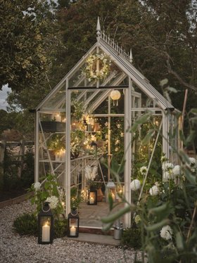 Glowing Spring Garden Shed with Fairy Lights, Easter Wreath, Festoon Lanterns & TruGlow® Outdoor Candles