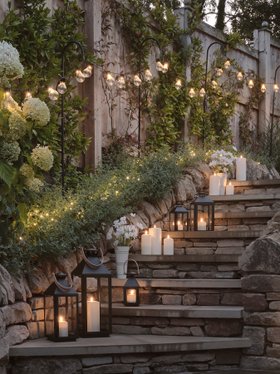 Glowing Spring Garden Lifestyle with TruGlow® Outdoor Candles, Black Lantern & Fairy Lights